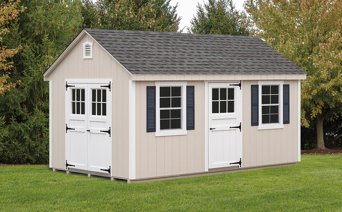 Heritage Deluxe Shed: deluxe tool shed with three doors and windows with shutters. Manufacturer example; size, finish and optional features vary.