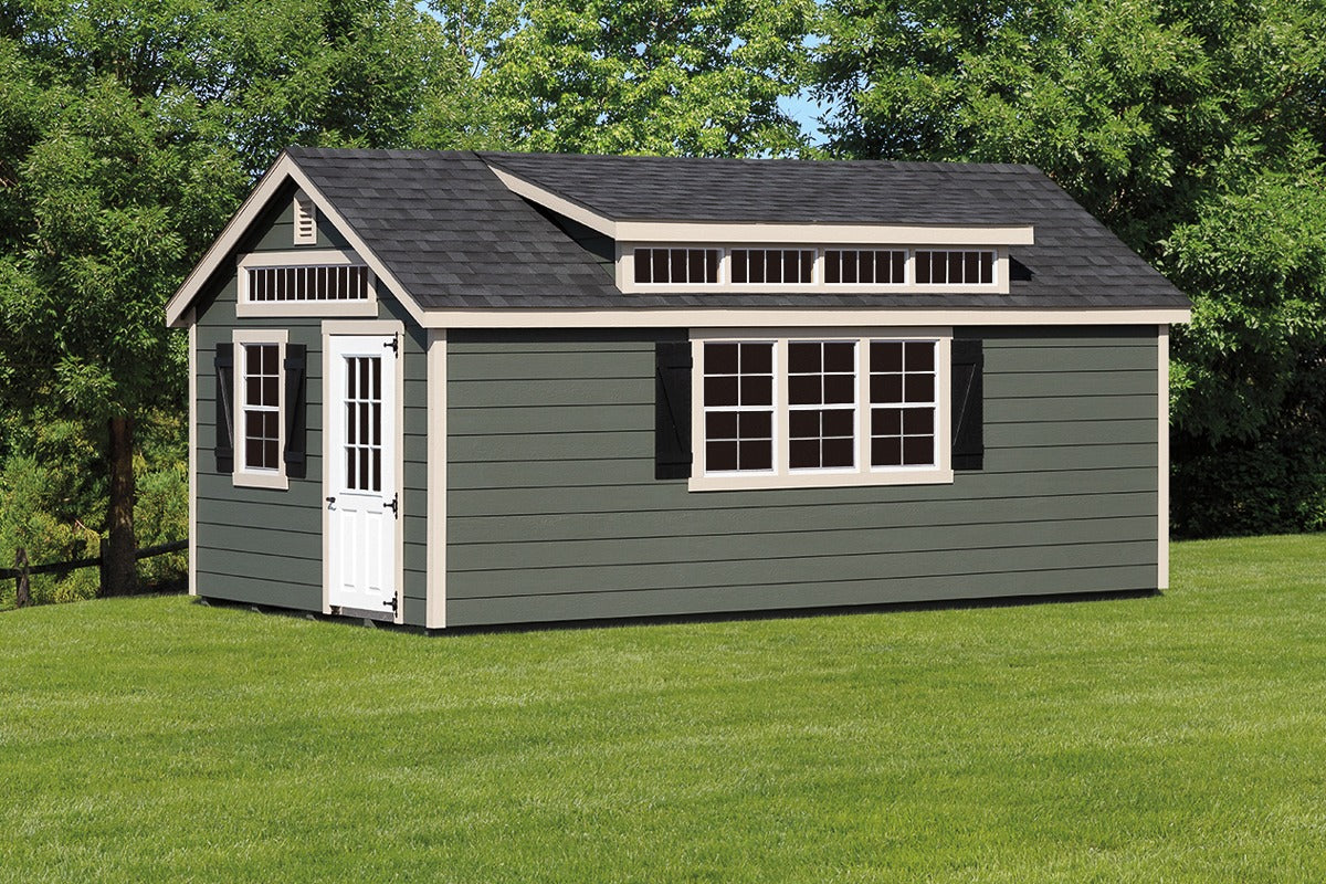 Heritage Garden Cottage Shed: green garden shed with transom windows and cream trim. Manufacturer example configuration; optional features may be shown.