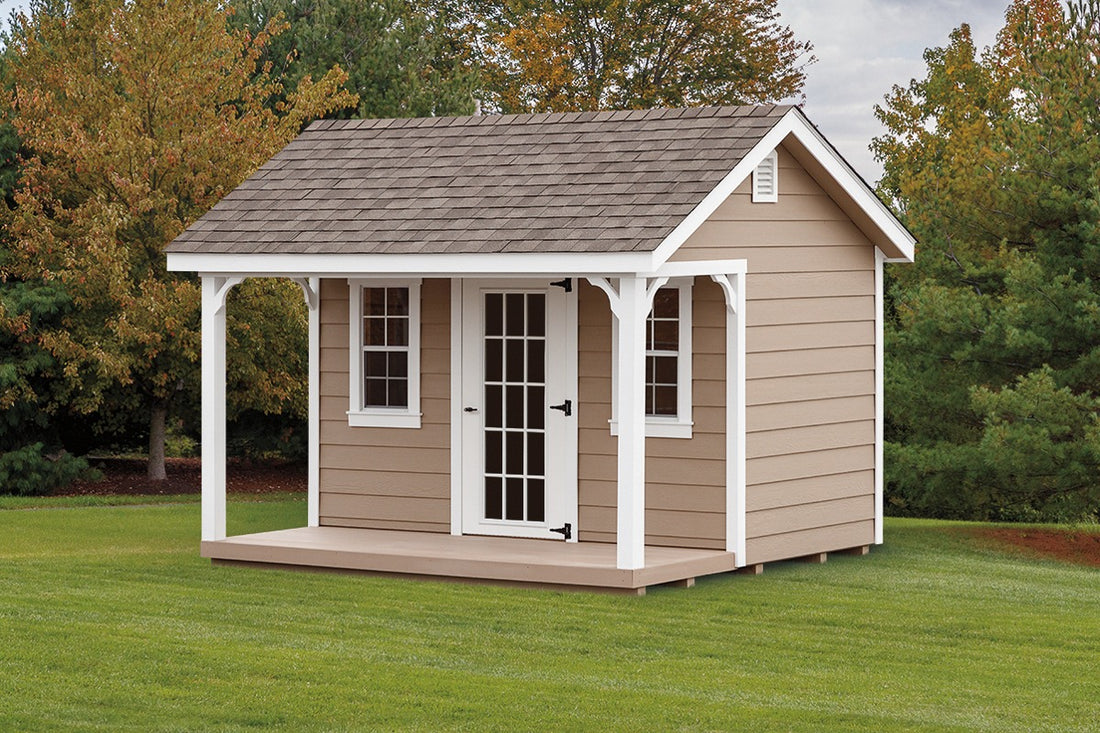 Heritage Garden Cottage Shed: Garden Cottage example with a covered porch and glazed door. Manufacturer example; size, finish and optional features vary.