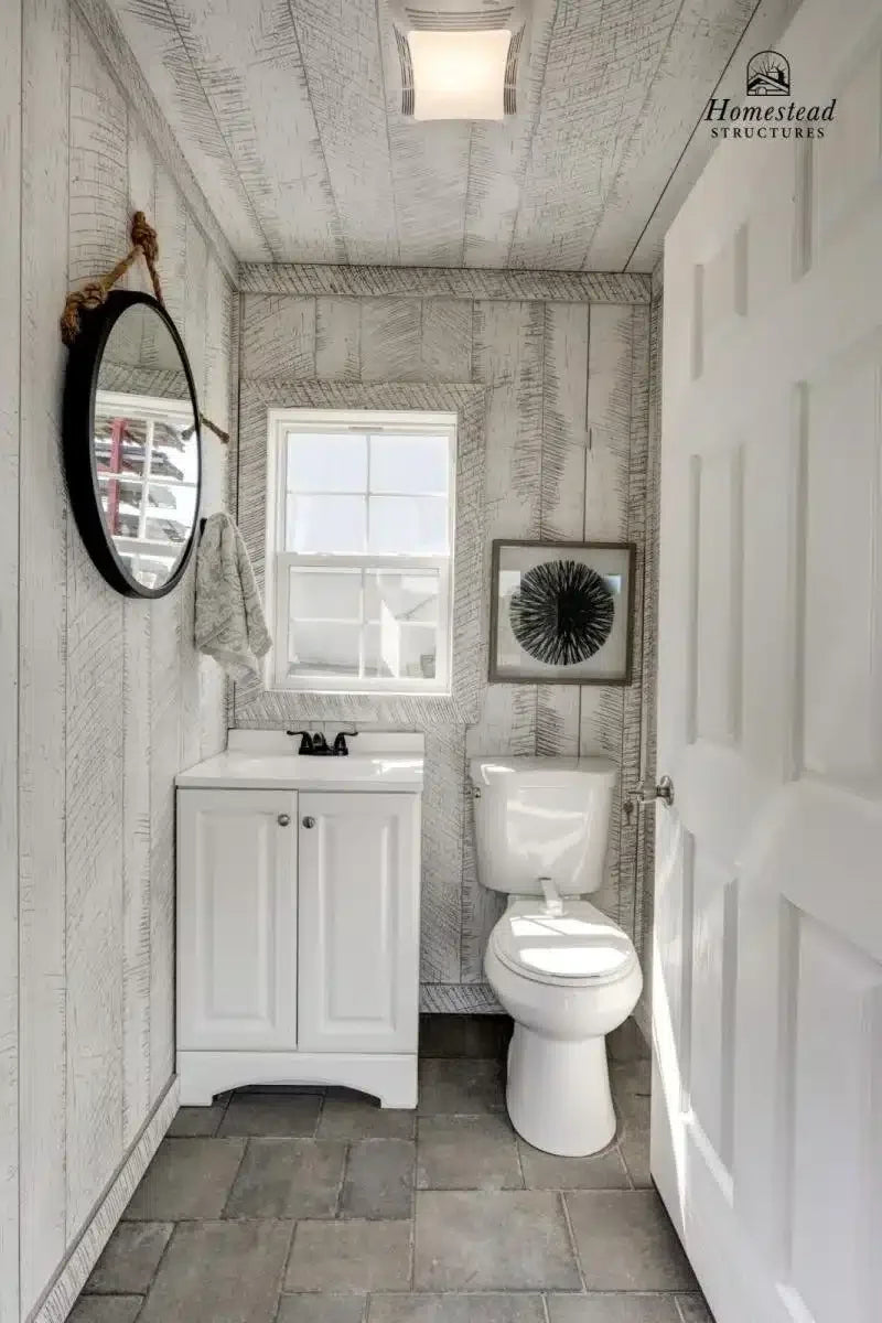 Homestead Structures Custom Avalon Pool House: Optional finished bathroom example. Manufacturer project example; layout, finishes and appliances are quoted separately.