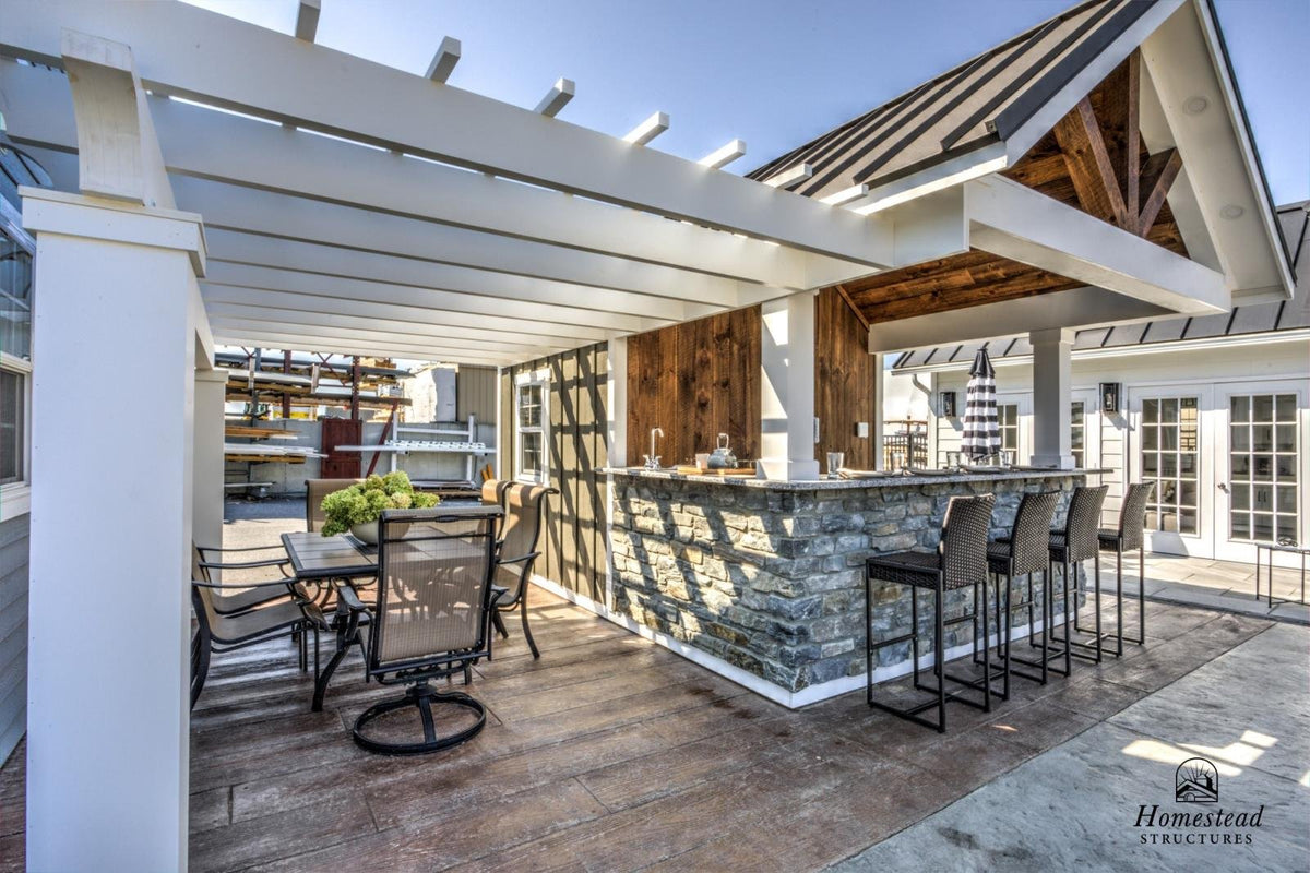 Homestead Structures Siesta Poolside Bar & Cabana: Covered bar and entry view. Manufacturer project example; furnishings, appliances and optional finishes are not confirmed inclusions.