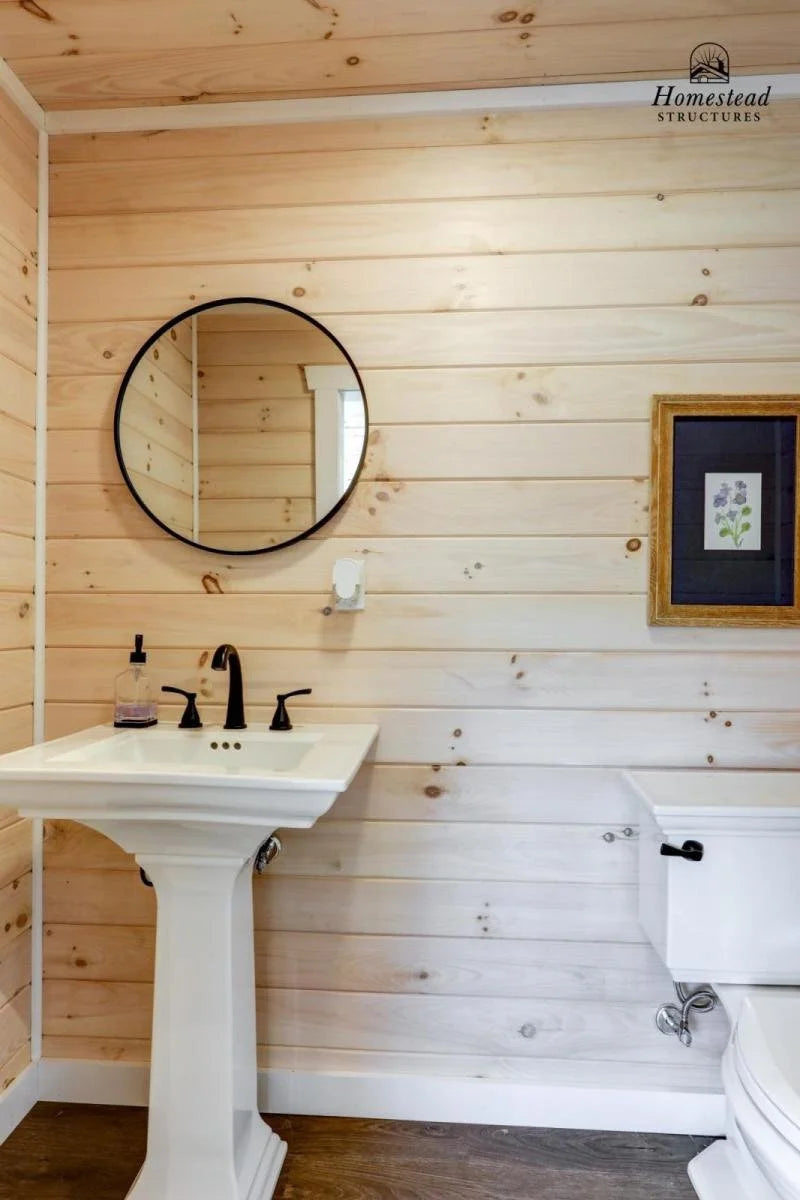 Homestead Structures Wellington Pool House: Optional bathroom interior. Manufacturer project example; furnishings, appliances and optional finishes are not confirmed inclusions.