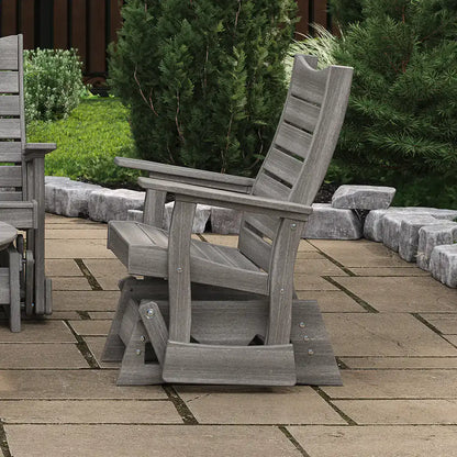 LuxCraft 2COPG, supplier side patio view in a gray finish, showing the slatted back, armrest and glider base. Manufacturer finish/configuration example; select the desired options separately. Other furniture, throw pillows, blankets and decorative accessories are not included.