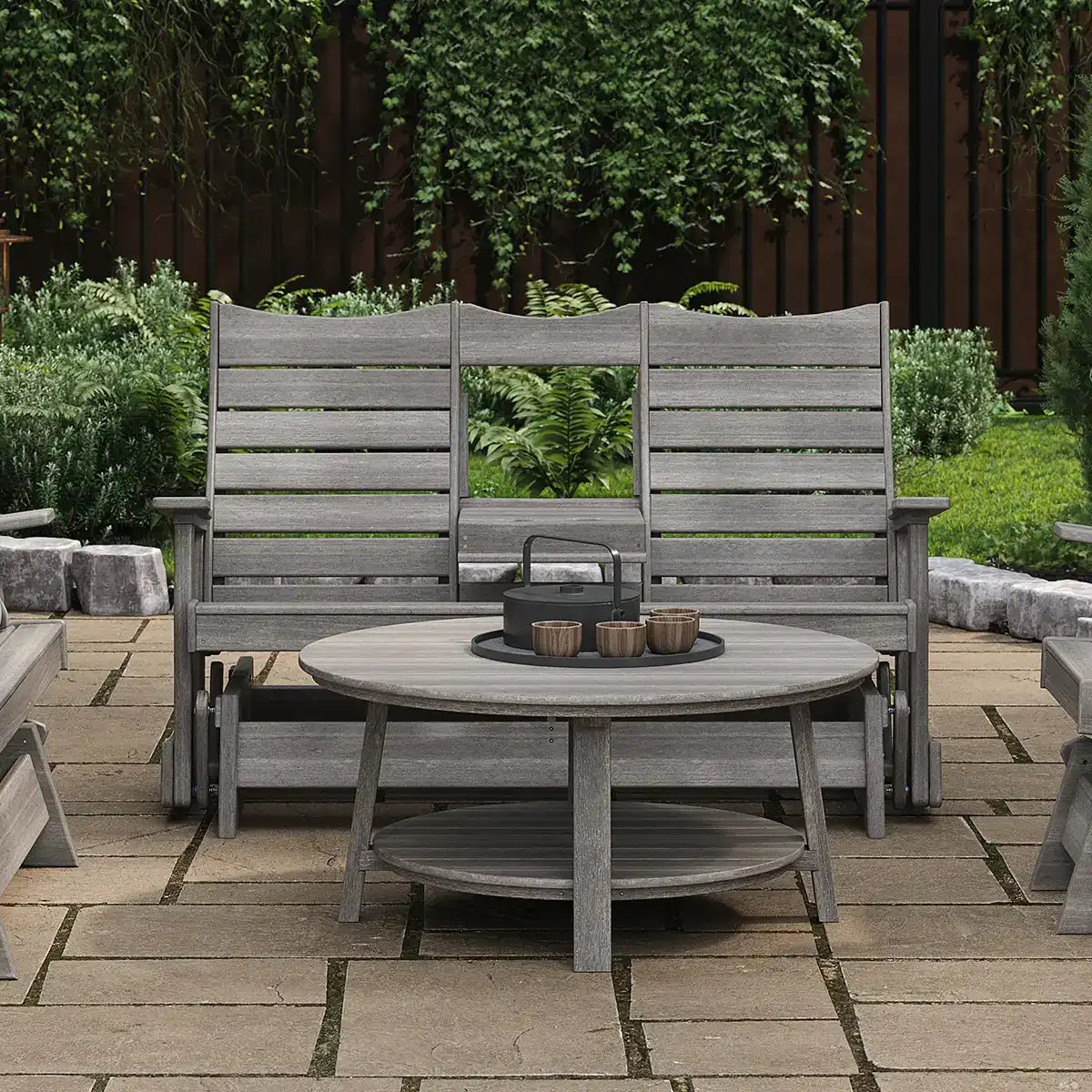 LuxCraft 5COPG, supplier patio view in a gray finish, showing the 5-foot Contour Glider with its center tray lowered. Manufacturer finish/configuration example; select the desired options separately. Other furniture, throw pillows, blankets and decorative accessories are not included.