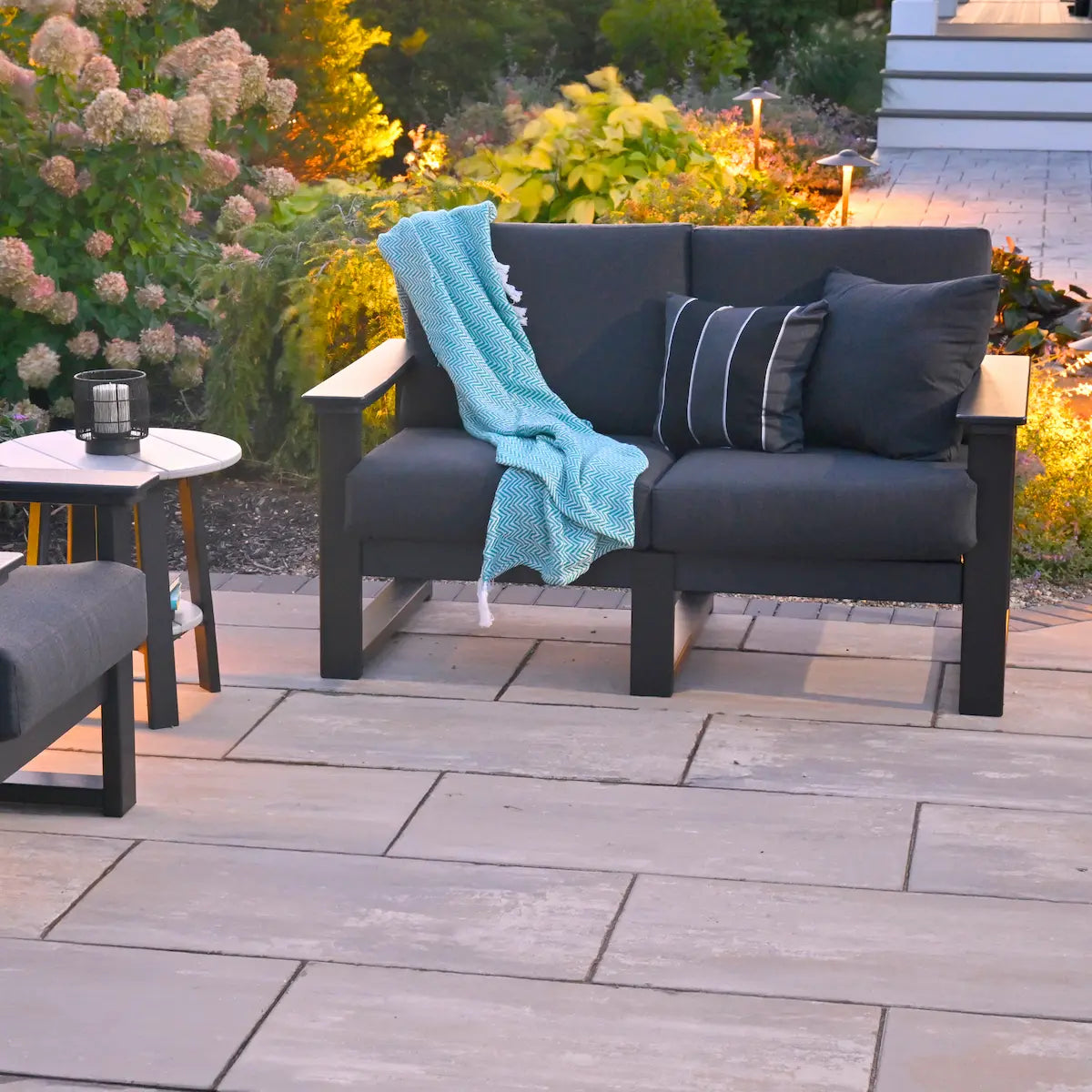 LuxCraft LDSL, supplier angled patio view in a dark frame and dark cushion configuration. Manufacturer finish/configuration example; select the desired options separately. Other furniture, throw pillows, blankets and decorative accessories are not included.