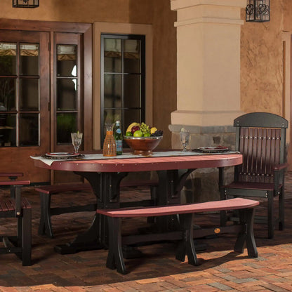 LuxCraft P46OT, supplier covered-patio view of the oval tabletop and pedestal base in a two-tone reddish-brown and dark finish. Manufacturer finish/configuration example; select the desired options separately. Other furniture, throw pillows, blankets and decorative accessories are not included.