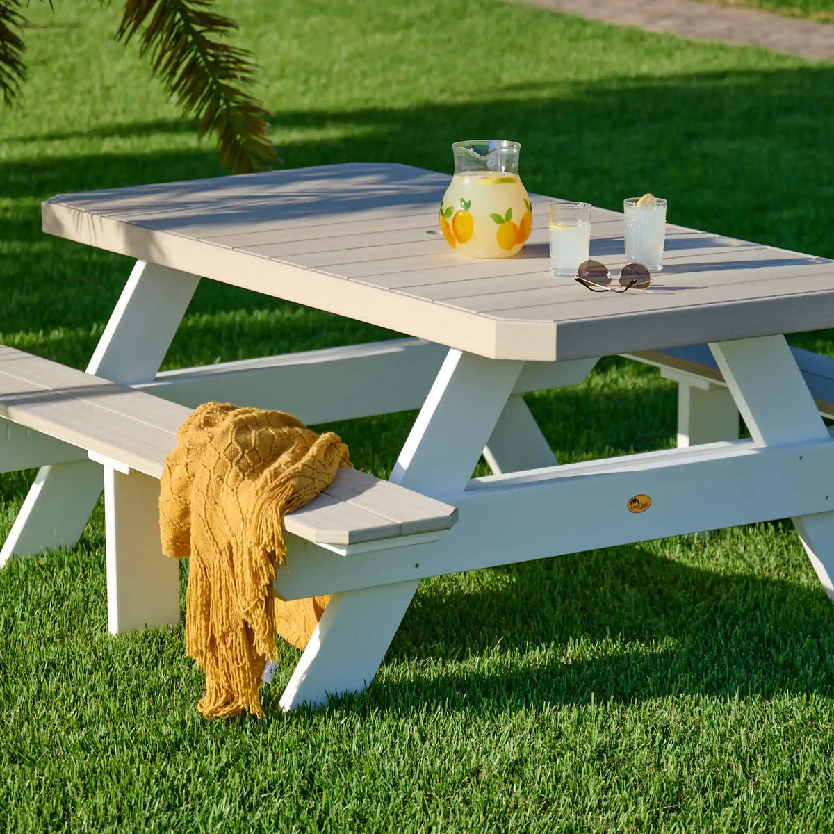 LuxCraft P6RPT, supplier angled lawn view in White, showing the tabletop and integrated benches. Manufacturer finish/configuration example; select the desired options separately. Tableware, blankets and decorative accessories are not included.