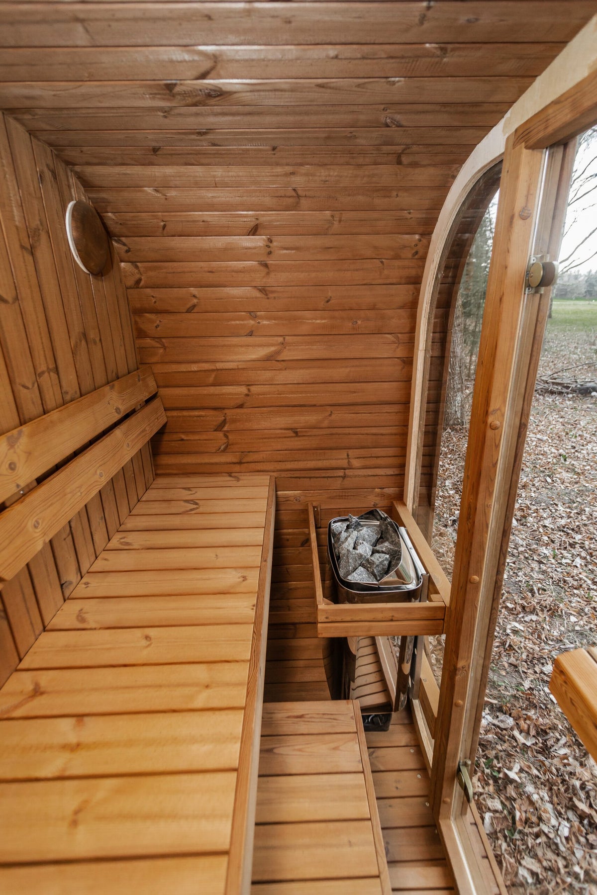 Mande Spa MW12 Outdoor Sauna — 2–3 Person, manufacturer photograph: interior seating and heater position; example configuration, options may vary