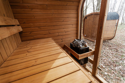 Mande Spa MW16 Outdoor Sauna — Up to 4 Person, manufacturer photograph: interior glazing and heater position; example configuration, options may vary