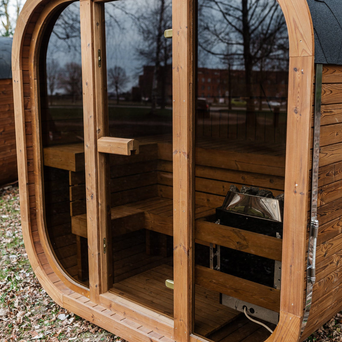 Mande Spa MW16 Outdoor Sauna — Up to 4 Person, manufacturer photograph: glass entry and interior; example configuration, options may vary
