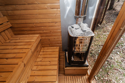 Mande Spa MW20 Outdoor Sauna — 5–6 Person, manufacturer photograph: interior heater and bench layout; example configuration, options may vary