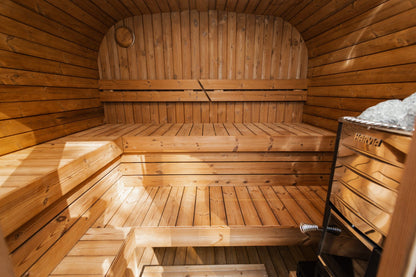 Mande Spa MW20 Outdoor Sauna — 5–6 Person, manufacturer photograph: two-level bench layout; example configuration, options may vary
