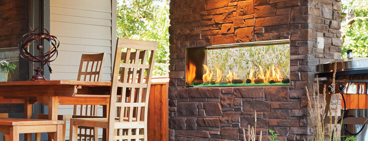 Outdoor Lifestyles Lanai 48 see-through outdoor gas fireplace; optional stone kit and masonry surround shown are not included